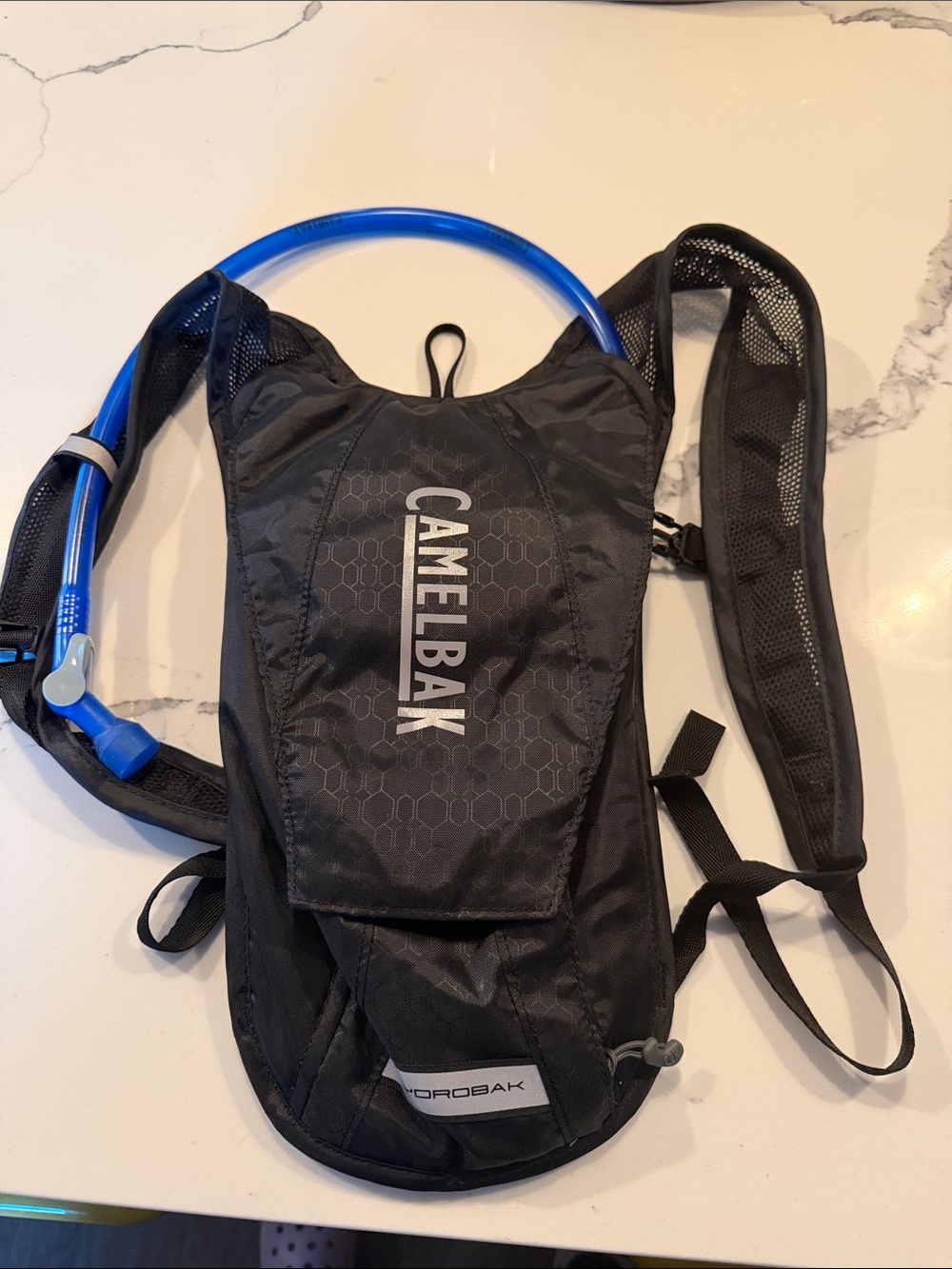 Camelbak Black Hydration Pack with Blue Drinking Tube